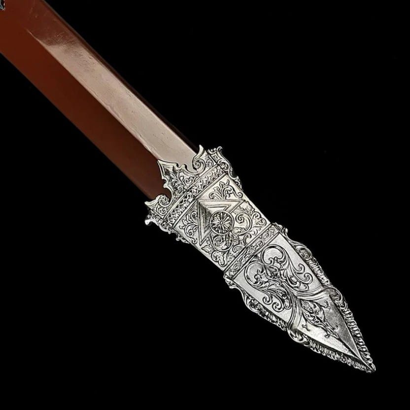 Close up of the Roman Gladius scabbard tip featuring detailed decorative metalwork and traditional Roman inspired styling