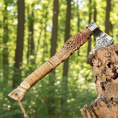 Decorative axe with wooden handle and metal head on a tree stump in a forest setting