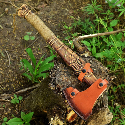 Decorative axe with leather sheath on a wooden stump in a natural setting