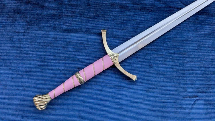 A decorative sword with a pink wrapped handle and gold-colored guard and pommel, displayed diagonally on a textured blue background.