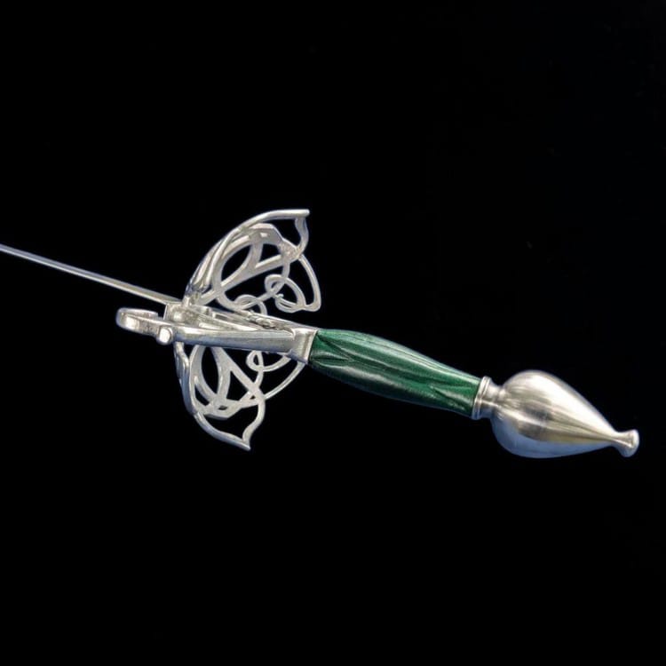 A decorative fencing or dagger-style sword with a polished silver-colored metal guard and pommel, featuring a green marbled handle, set against a solid black background.