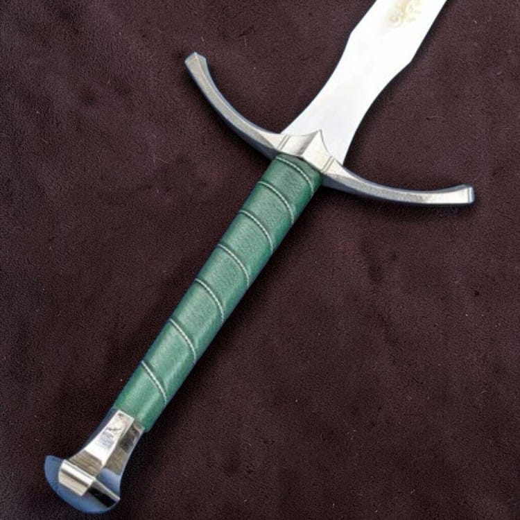A medieval-style sword with a green wrapped handle and silver-colored steel blade, shown diagonally on a dark brown textured background.