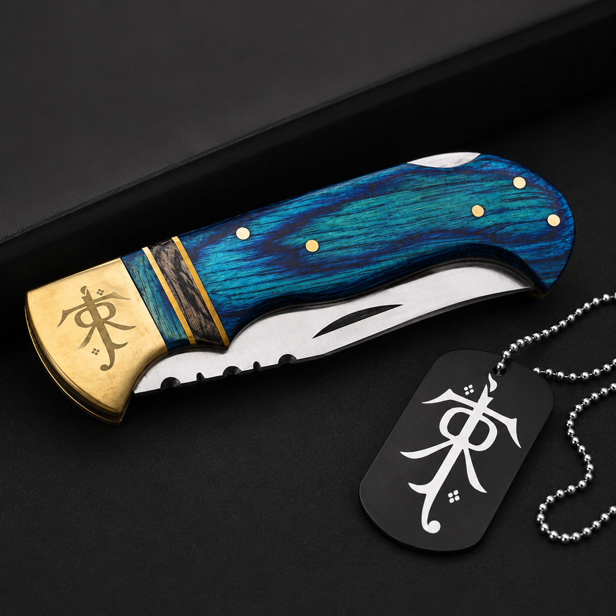 Blue Pakka wood folding pocket knife displayed with an engraved collectible gift locket, showcasing handcrafted details and premium finish.
