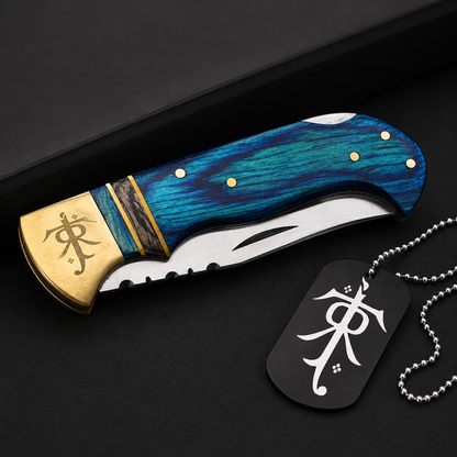Blue Pakka wood folding pocket knife displayed with an engraved collectible gift locket, showcasing handcrafted details and premium finish.