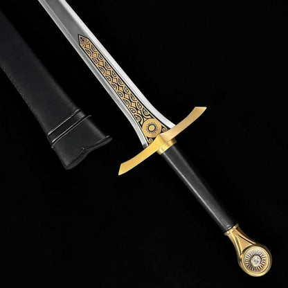Handcrafted medieval fantasy sword featuring a detailed brass guard, engraved fittings, ergonomic black handle, and premium carbon steel blade.