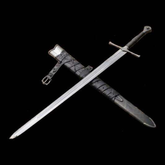 Medieval longsword and leather scabbard arranged diagonally against a black background