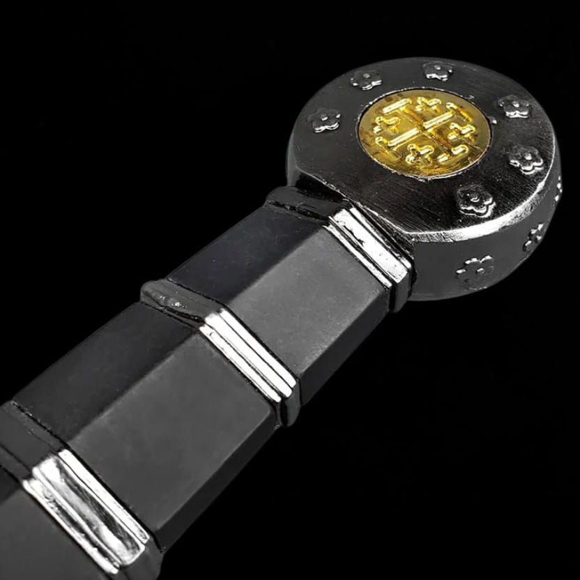 Close-up of the Knights Templar medieval sword pommel featuring decorative Templar emblem and black handle