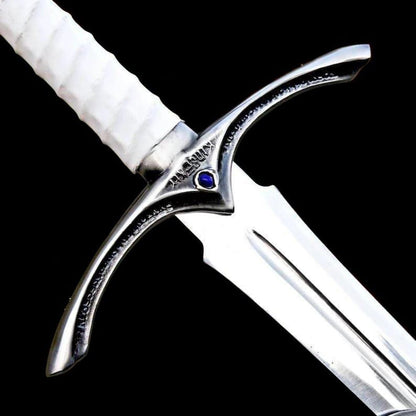 Close up image of the medieval knight longsword crossguard and polished high steel blade with decorative steel detailing