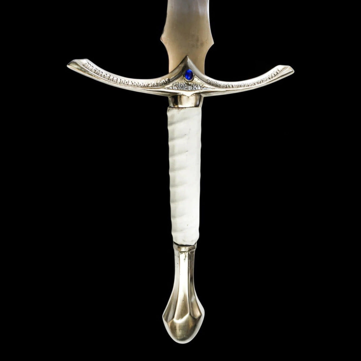 Close-up of handcrafted medieval long sword featuring an engraved silver crossguard, white grip handle, blue accent stone, and polished craftsmanship.