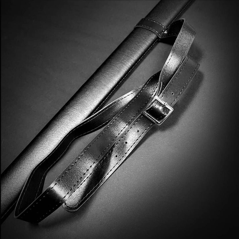 Close-up of a medieval sword scabbard with black leather finish and adjustable carry strap