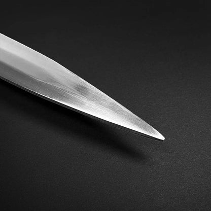 Close up view of the polished steel blade tip of a medieval sword with a refined metallic finish
