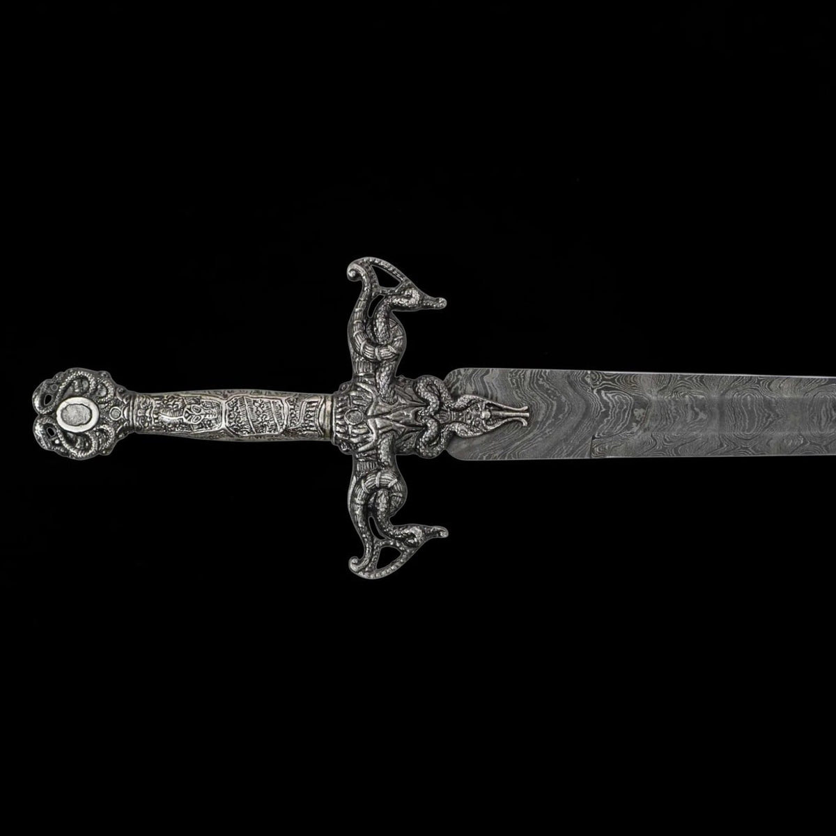 Close-up of the Renaissance Long Sword featuring an ornate medieval style hilt and Damascus pattern steel blade.