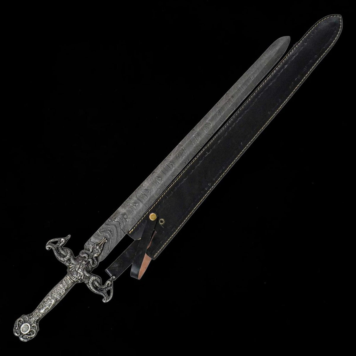 Renaissance Long Sword displayed with black leather scabbard, Damascus pattern blade and decorative medieval style handle.