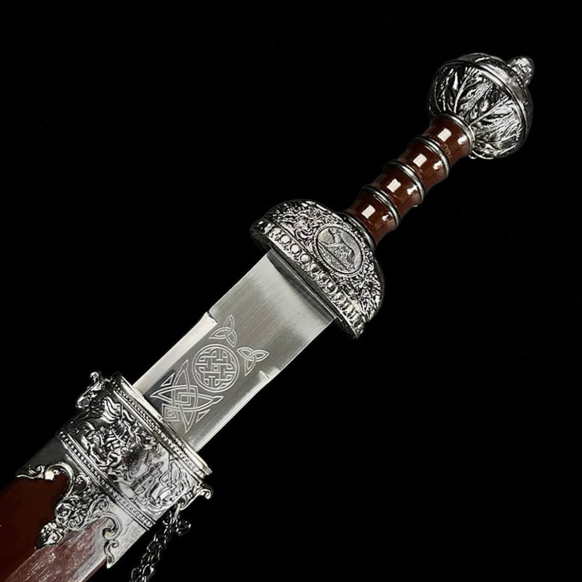 Close-up of the Roman Julius Caesar Gladius sword handle with detailed decorative pommel and engraved guard