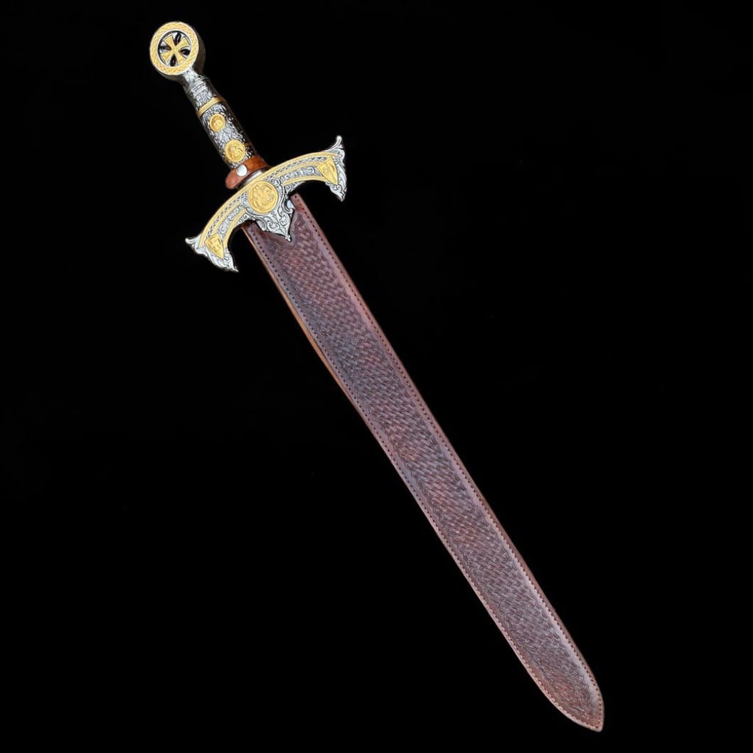 Handmade Templar Damascus steel sword inside a brown leather sheath with decorative metal handle and medieval inspired detailing